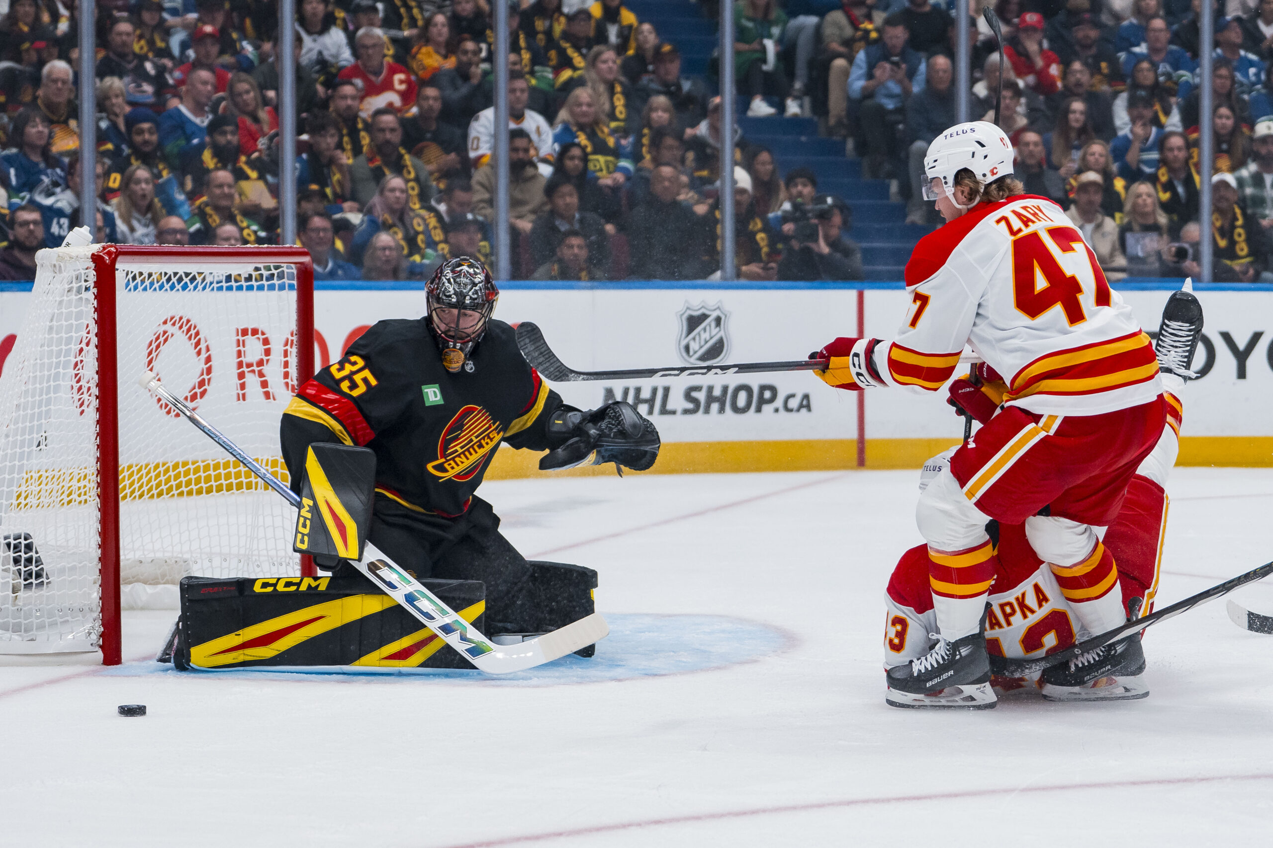 3rd Period Tsunami: Canucks Drown Flames 5-1 in Season Opener